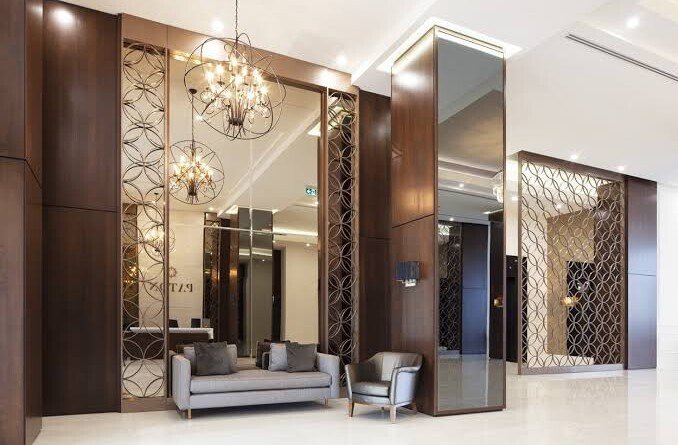 Decorative mirror reflecting natural light into a living room